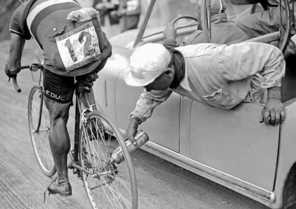10. Mechanic lubricating Gino Sciardis' chain during the 1949 Tour De France